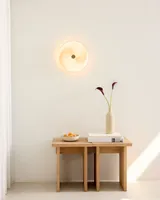 Stockholm Plafond Grå fra Halo Design på et sidebord i en entré - rolig og minimalistisk atmosfære